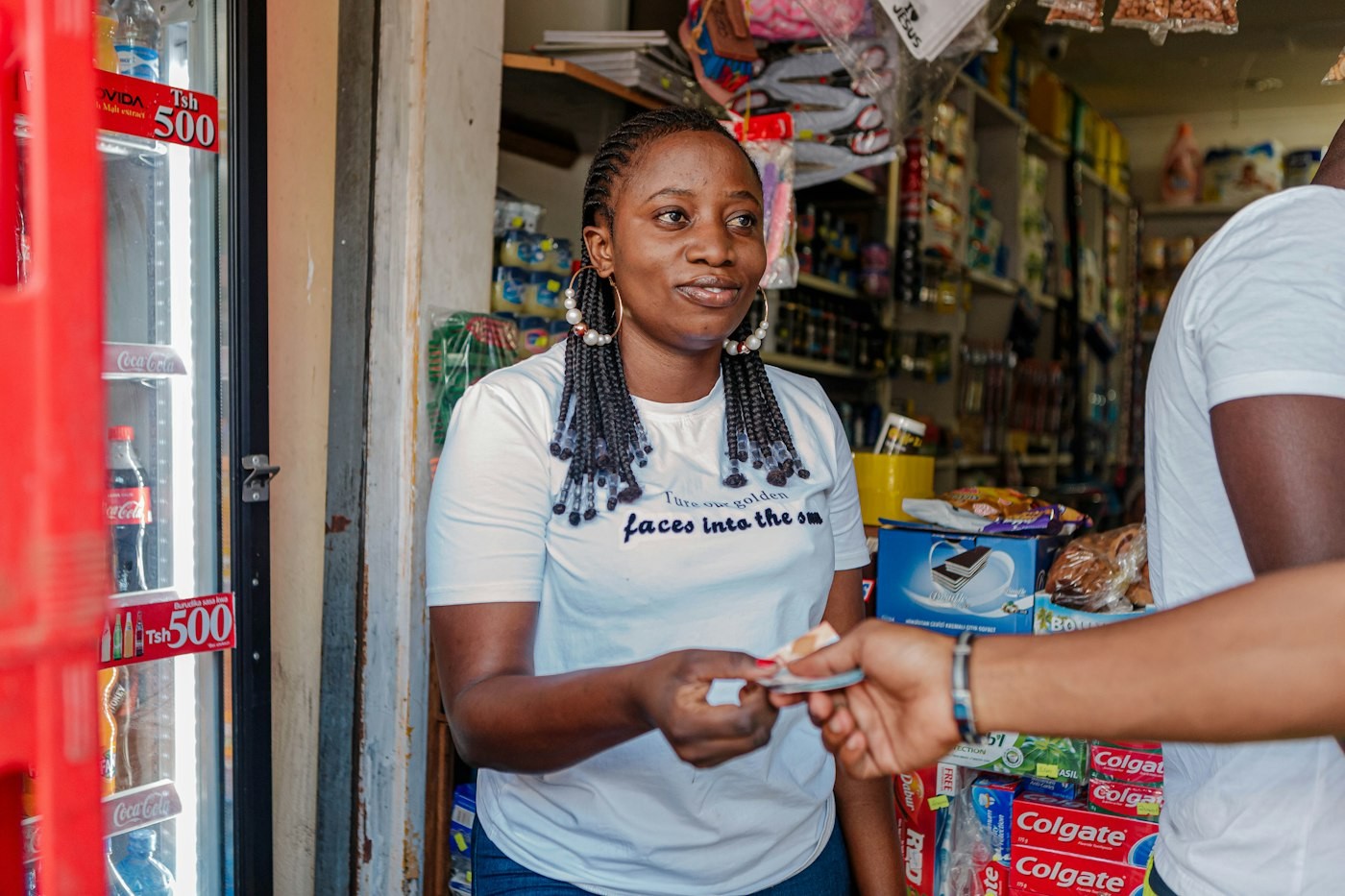 Shopkeeper taking a card payment from a customer